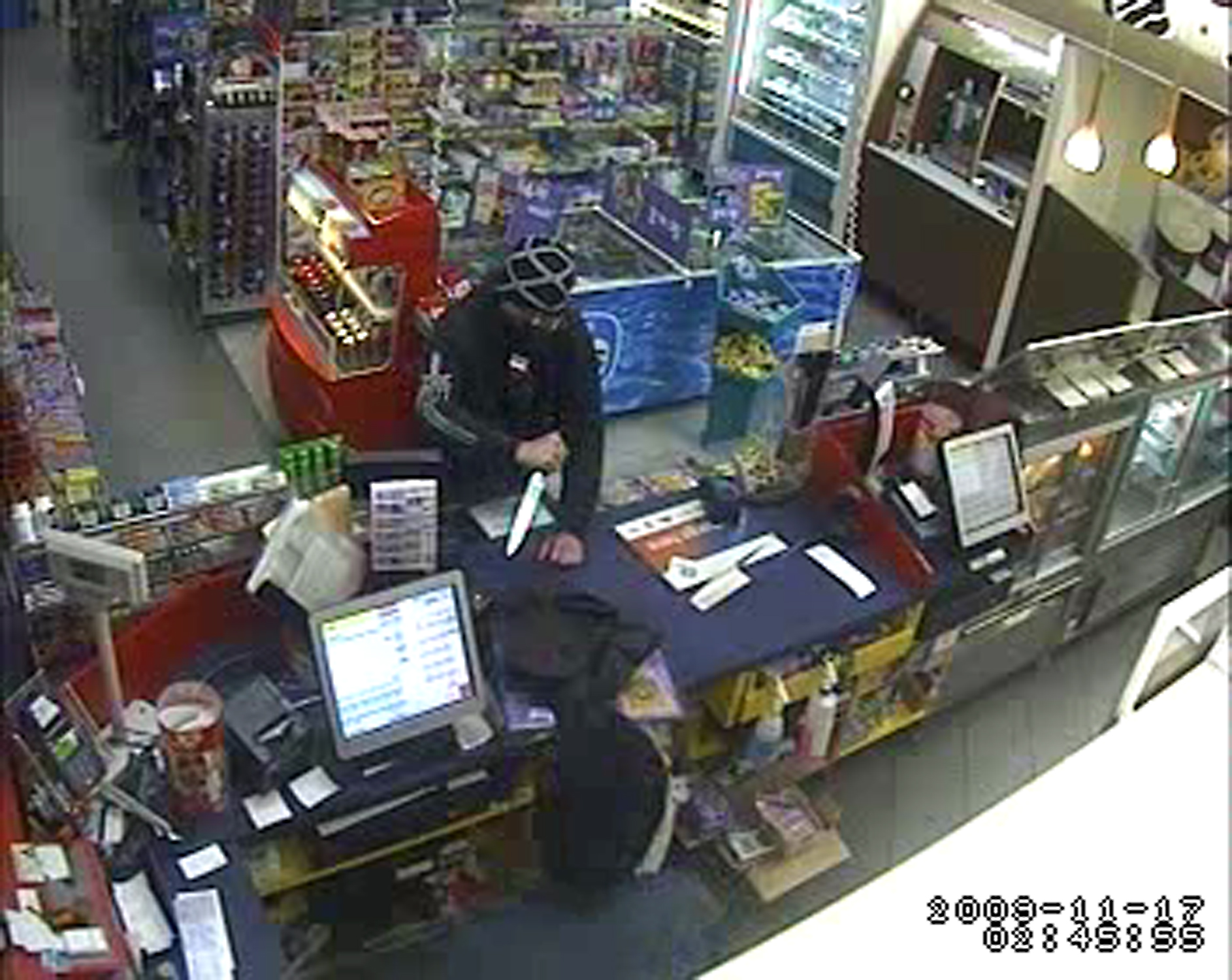 A still taken from CCTV footage of the Caltex service station aggravated robbery in Braddon (1 of 2)